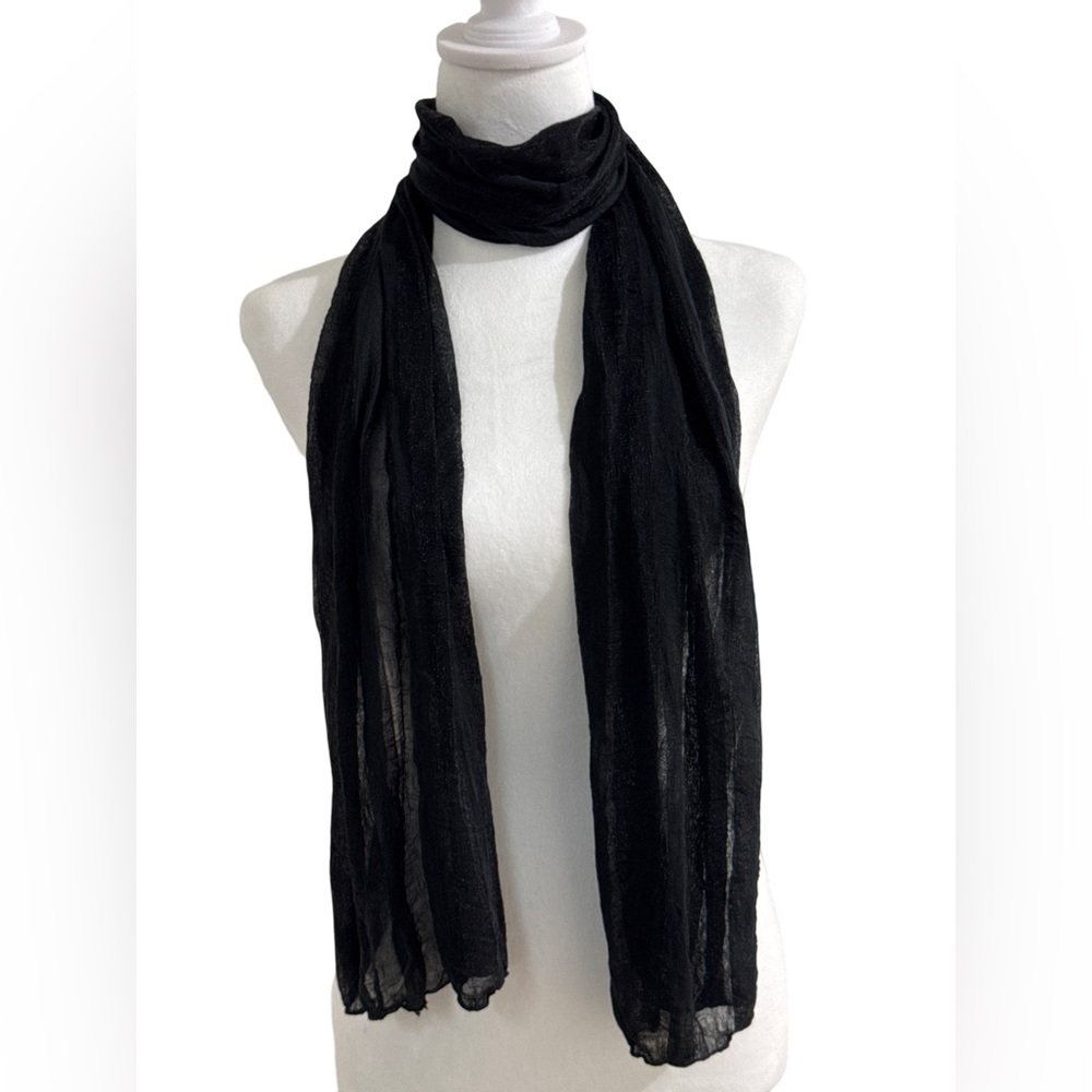 Woman’s black light scarf.